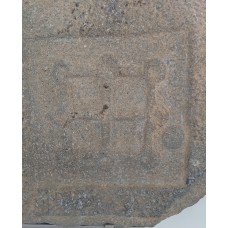 Cross symbol on a door of a tomb